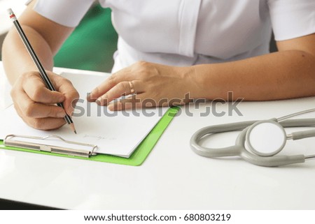 Nurse taking notes