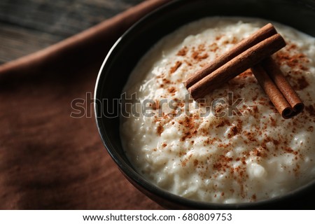 Delicious rice pudding with cinnamon in bowl, closeup Royalty-Free Stock Photo #680809753