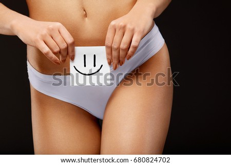 Women Health. Closeup Of Healthy Female With Beautiful Fit Slim Body In White Panties Holding White Card With Happy Smiley Face In Hands. Stomach Health And Good Digestion Concepts. High Resolution 