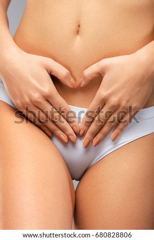 Woman Body Care. Beautiful Healthy Girl With Fit Slim Body Touching Flat Tight Belly. Close-up Of Female In White Panties Holding Hands On Stomach. Feminine Health, Digestion Concept. High Resolution