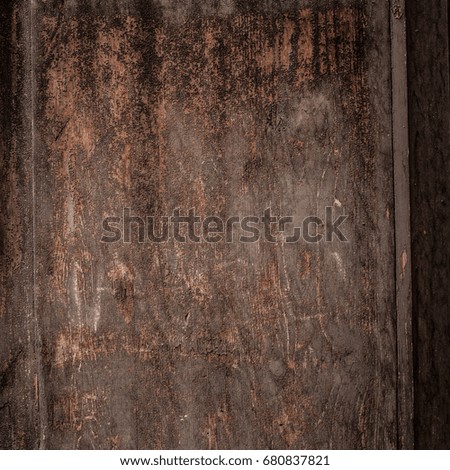 Wooden brown background grunge texture dark color. Textured Wall with scratches, weathered wood surface
