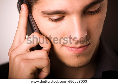 Adult talking over phone