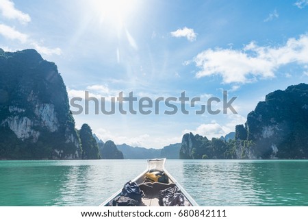 Traditional wooden boat in a picture perfect tropical bay. Wooden boats take tourists in dam