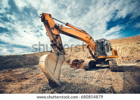 Close up details of industrial excavator working on construction site Royalty-Free Stock Photo #680854879
