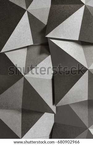 Geometric shapes of silvery paper, grainy texture