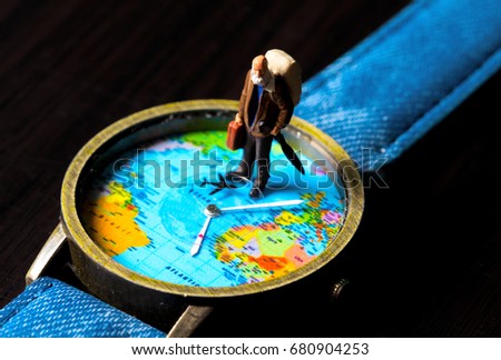 Aged man and world map travel watches. World travel photo banner. Senior traveler figurine. Retired backpacker travel. World time zone. Travelling around world concept. Senior age travel. Time of life