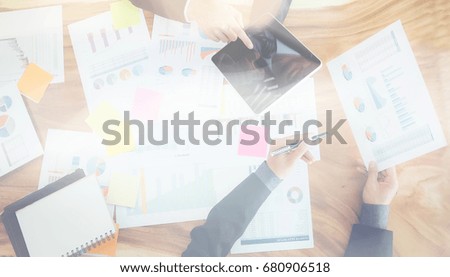 Business teamwork concept working with digital tablet and blurred focus for start up business and education background