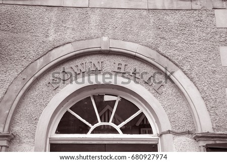 Town Hall Sign on Building Facade in Black and White Sepia Tone