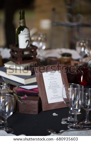 Table menu and books and glasses wedding decorations