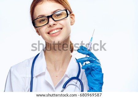 Therapist with syringe and neck stethoscope                               
