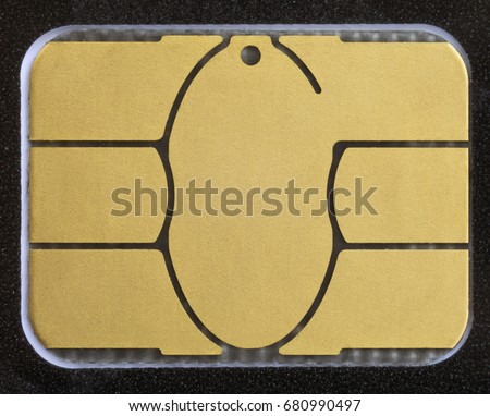 Macro shot of electronic chip on a credit card or debit card. Image for technology or finance background. Royalty-Free Stock Photo #680990497