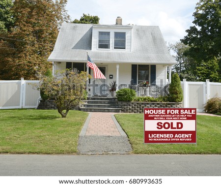 Real Estate Sold Sign front yard lawn Suburban Bungalow home USA