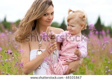young woman and girl in meadow