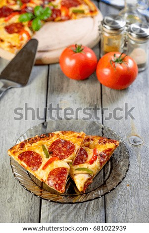 Pizza pepperoni cut into pieces. Selective focus.