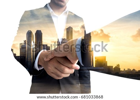 Double exposure of Business handshake. Business hands shake and business people concept.