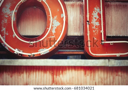 Decaying detail of vintage neon sign and letters abstract background