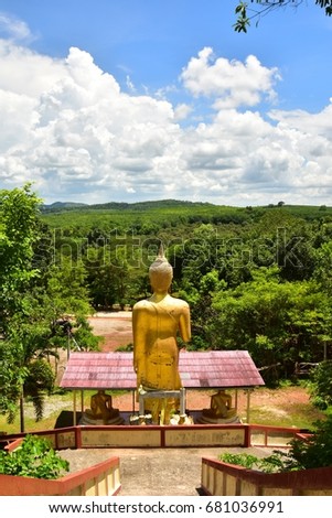 The back of the Buddha stands in the temple, Thailand.