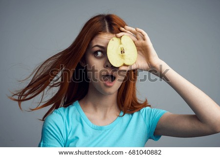 Woman with half an apple, fruit, diet, nutrition                               