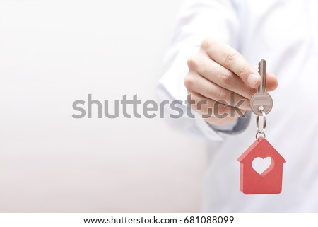 House key with heart in hand 