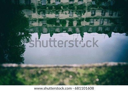 reflection of buildings in canal Saint Martin paris