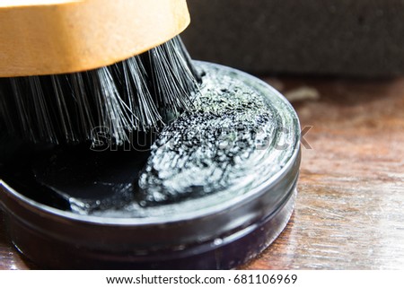 Shoe polish and blush on wooden table,Still life photography