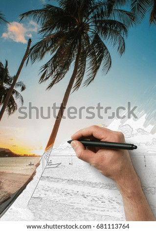 The male hand drawing picture from photo with a pen