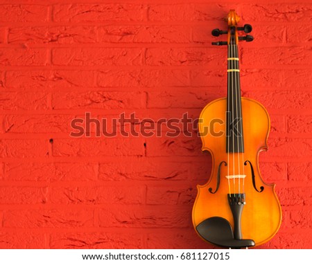 violin on red stone background