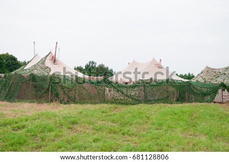 Military camp of Russian troops. Tents fenced disguise.