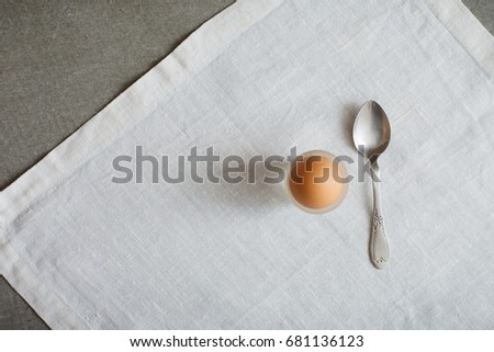 Served Table Boiled Egg on Support Teaspoon White Crumpled Striped Napkin Top View Minimal Picture on Grey Vintage Background Vintage Minimalism Style Grey Table
