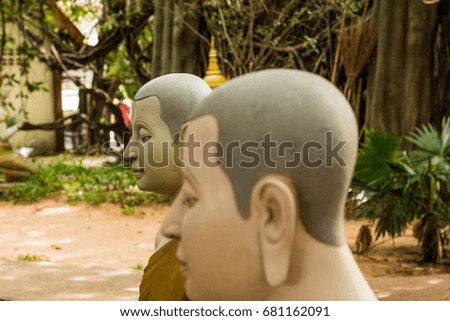 Art stucco head or Buddha face Prophet of the Buddhist religion that looks calm.
