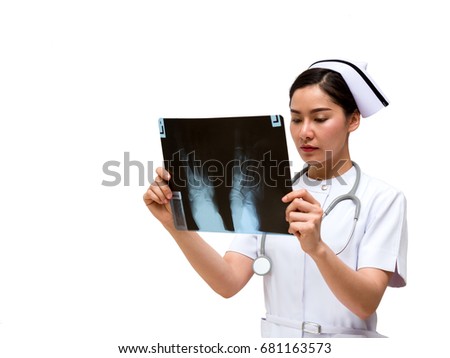Young Asian nurse look at x-ray film to check current symptom on white background, Checking radiology photo