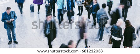 Anonymous blurred people commuting traveling walking standing
