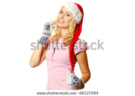 Close-up of beautiful young girls in warm mittens and a red Santa Claus hat. Isolated on a white background