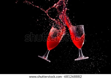 red wine glasses splashing
