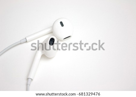 Concept of digital music white headphones with copy space for insert wording or image
