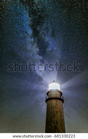 Milky Way rising over lighthouse Royalty-Free Stock Photo #681330223