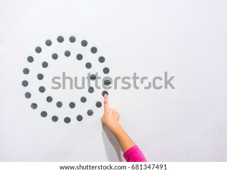 Asian kid finger pointing dot graphic of circle diagram on white wall. Learning education information with interface design concept with copy space.