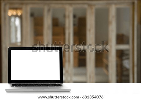 Conceptual Design,Workspace desk white with Laptop screen at blurred background of wooden room.