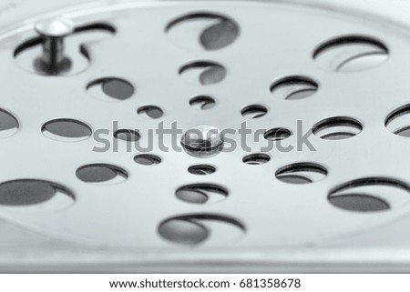 Close up chrome drain isolated on white background