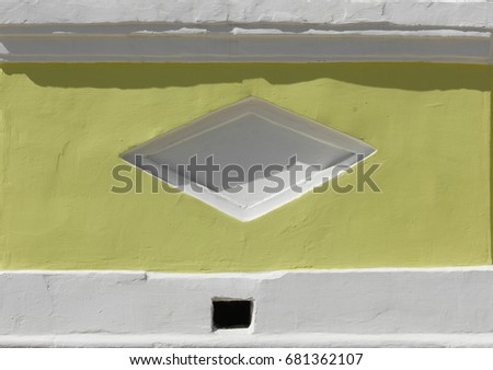 Texture, background. window. The architecture of the old building.  light and shadow in architecture