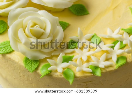 Butter yellow cake with marzipan roses.