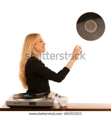 attractive blond woman throwing LP into the air