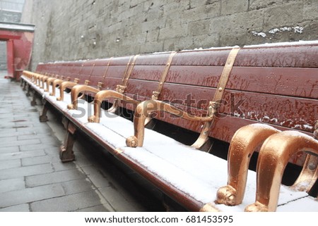 The benches which covered by snow