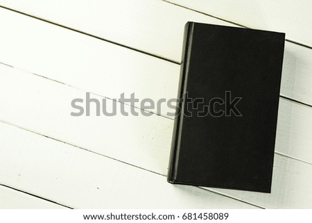 Bible and a crucifix on a white table. Beautiful background.Religion concept.