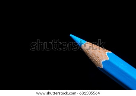 blue color pencil on black background