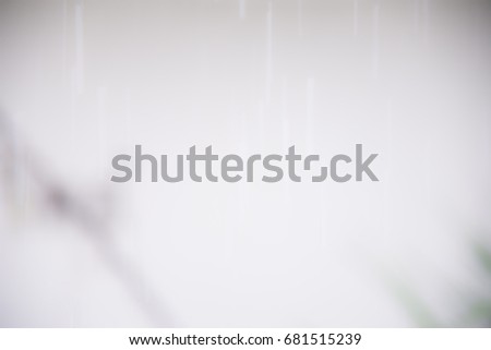 Blurred white raining abstract background.