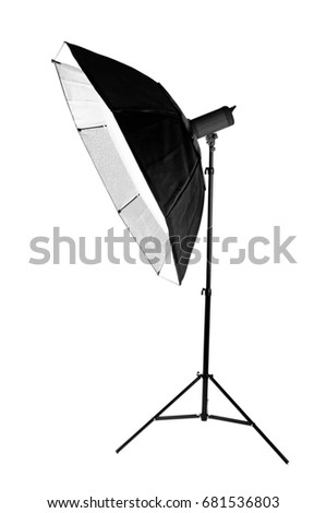 A modern electric saturated black octobox on a tripod. A huge octobox isolated over the white background. Equipment for photographers. Professional shooting in a photo studio. 