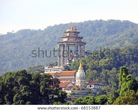 An exotic standing Goddess of Mercy, Kwan Yin, statue in the famous Kek Lok Si buddhist temple in the remote area of Ayer Itam of Penang Island. Royalty-Free Stock Photo #68153887