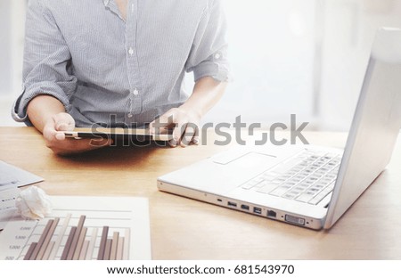 Man hand touching screen on modern digital tablet.icons