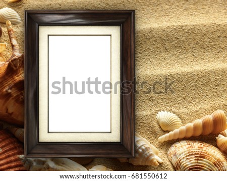 Pictue frame on shells and sand background. Copy space.